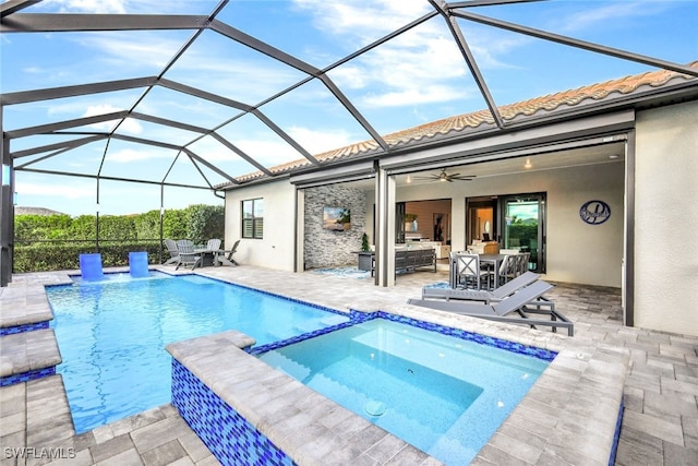 view of swimming pool with an in ground hot tub, a patio, ceiling fan, a lanai, and an outdoor hangout area