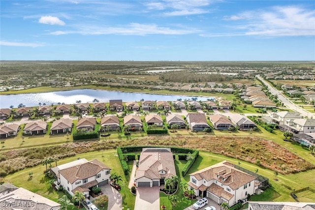 drone / aerial view with a water view