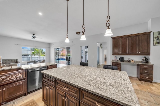 kitchen featuring ceiling fan, light stone countertops, pendant lighting, stainless steel dishwasher, and dark brown cabinetry