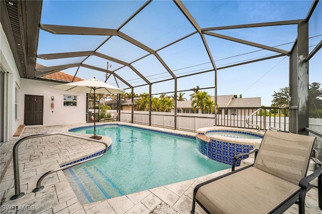 view of swimming pool with a lanai, an in ground hot tub, and a patio