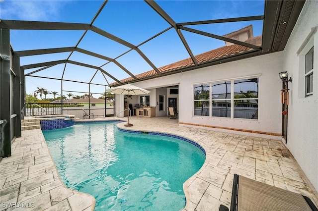 view of pool featuring a lanai, an outdoor kitchen, a patio, and an in ground hot tub