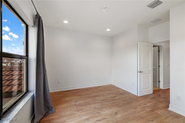 empty room with light wood-type flooring