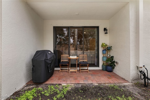 doorway to property with a patio