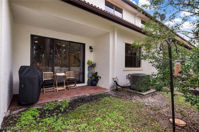 exterior space with central AC and a patio area