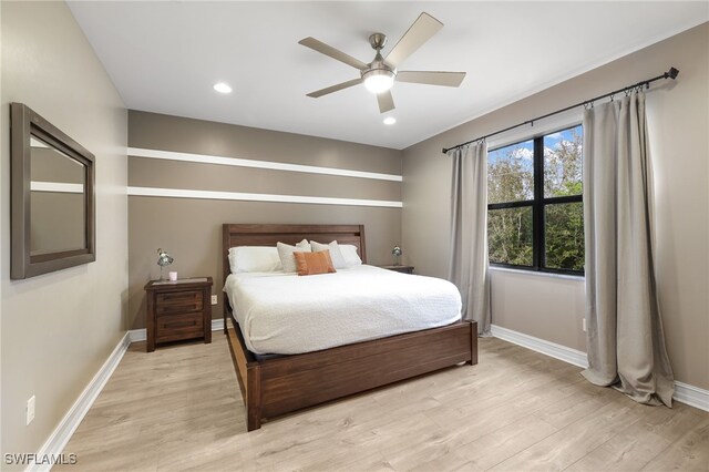 bedroom featuring ceiling fan and light hardwood / wood-style floors