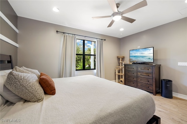 bedroom featuring ceiling fan and light hardwood / wood-style floors