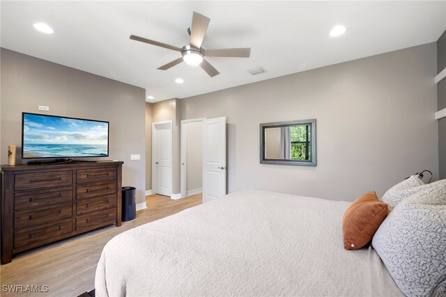 bedroom featuring ceiling fan and light hardwood / wood-style flooring