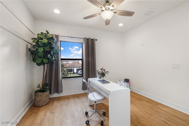 office space featuring ceiling fan and light hardwood / wood-style floors