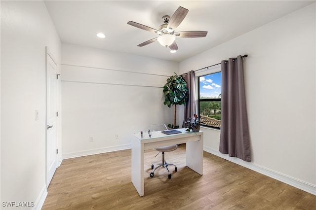 home office featuring ceiling fan and light hardwood / wood-style floors