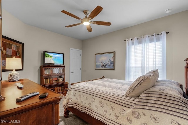 carpeted bedroom with ceiling fan