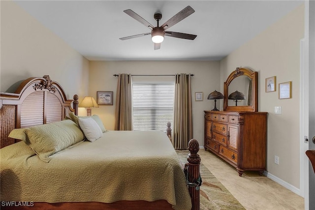 bedroom with a ceiling fan, baseboards, and light tile patterned floors