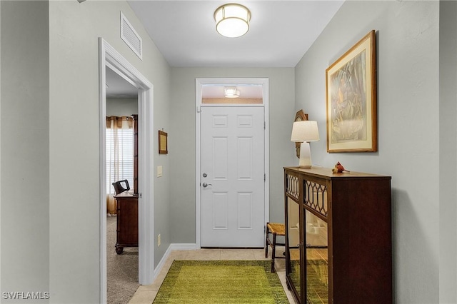 entrance foyer with light colored carpet