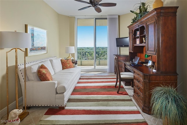 office space with ceiling fan and floor to ceiling windows