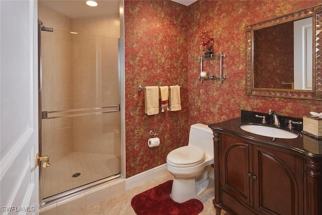 bathroom featuring toilet, tile patterned flooring, walk in shower, and vanity