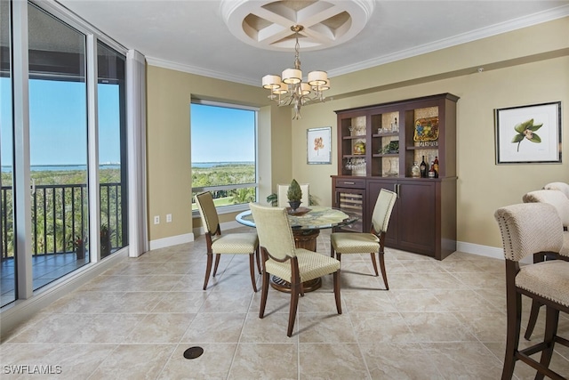 dining space featuring a chandelier and crown molding