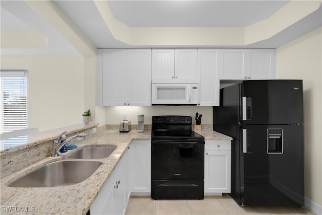 kitchen with black appliances, white cabinets, sink, and light stone counters