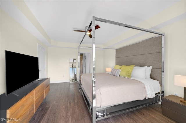 bedroom with ceiling fan and dark wood-type flooring