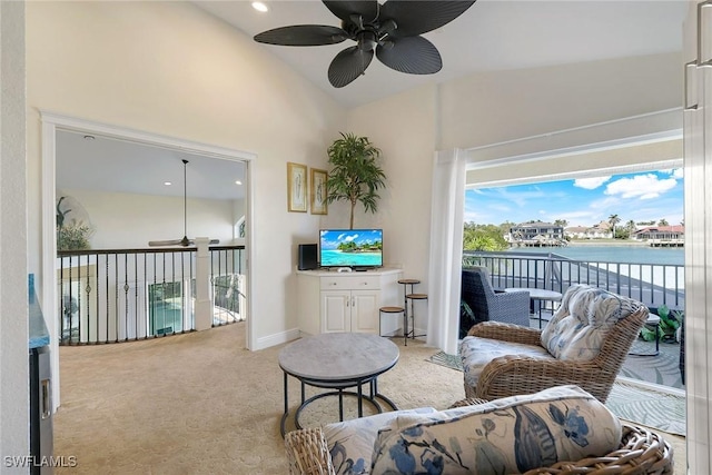 carpeted living room featuring ceiling fan and lofted ceiling