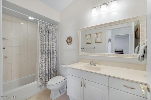 bathroom with tile patterned floors, shower / bath combo with shower curtain, toilet, and vanity