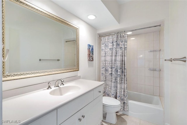 full bathroom featuring tile patterned floors, shower / bath combo with shower curtain, toilet, and vanity