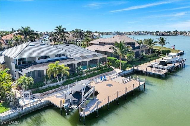 aerial view featuring a residential view and a water view