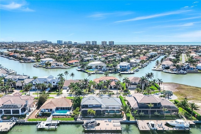 aerial view featuring a residential view and a water view