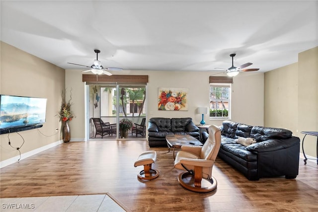 living room with hardwood / wood-style flooring and ceiling fan