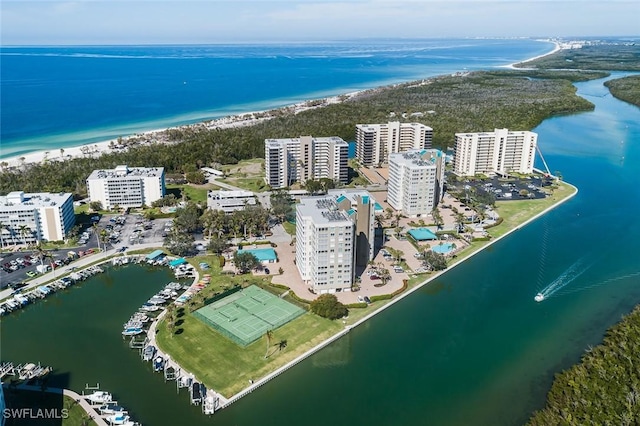 bird's eye view featuring a beach view and a water view