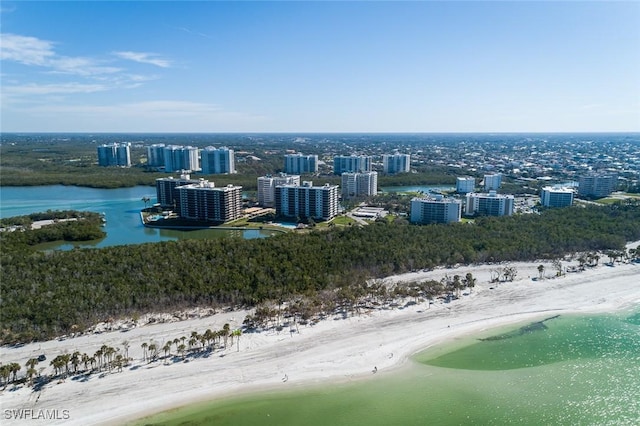 bird's eye view featuring a water view and a beach view