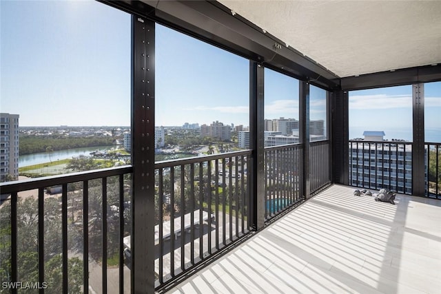 balcony featuring a water view