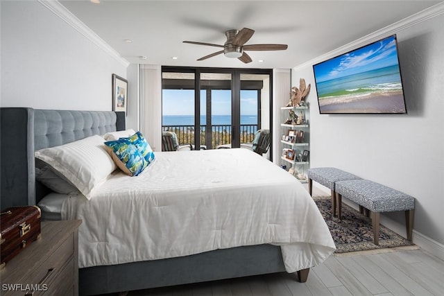 bedroom with a wall of windows, ceiling fan, access to exterior, hardwood / wood-style floors, and ornamental molding