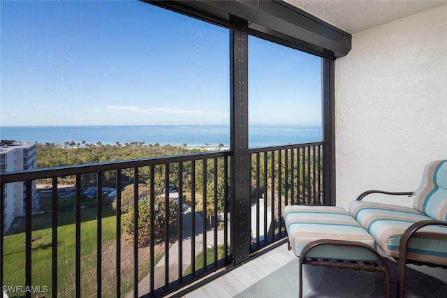 balcony featuring a water view