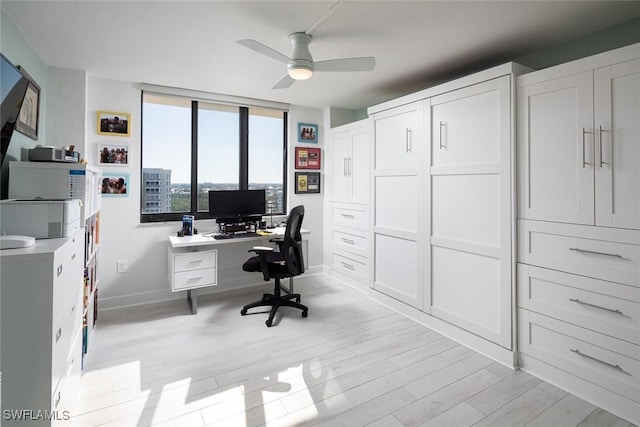 office area with ceiling fan and light hardwood / wood-style flooring