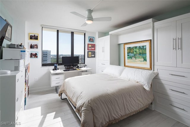 bedroom with ceiling fan and light hardwood / wood-style flooring