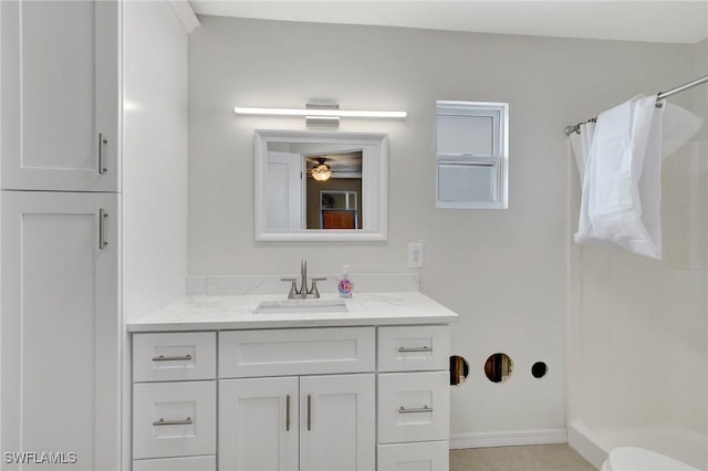 bathroom featuring vanity, toilet, and walk in shower