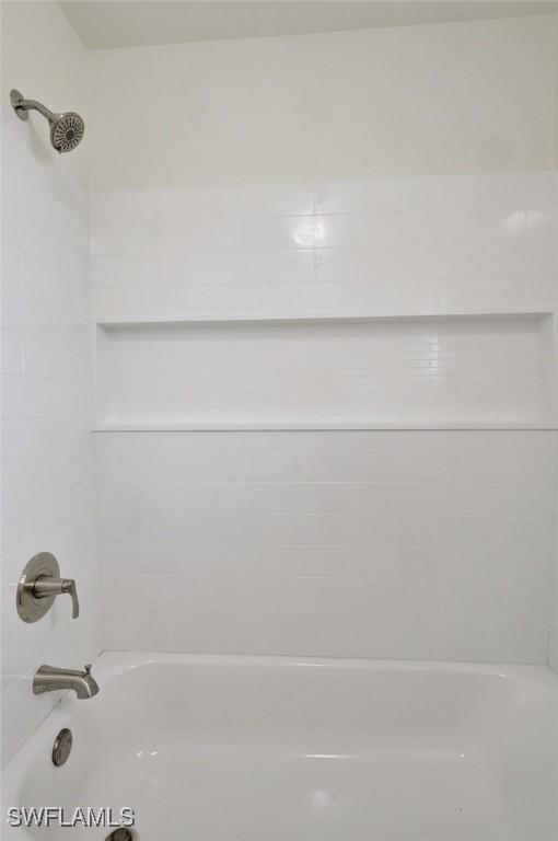 bathroom with shower / bathtub combination