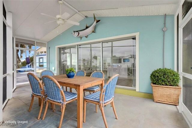 sunroom featuring ceiling fan and lofted ceiling