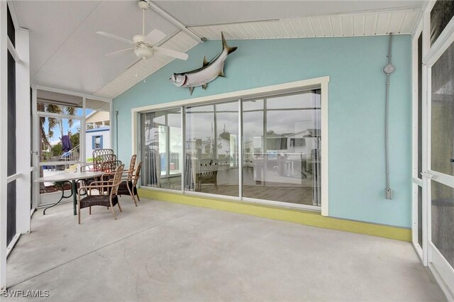 sunroom with vaulted ceiling and ceiling fan