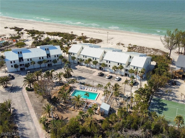 aerial view with a water view and a view of the beach