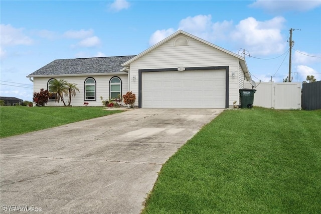 ranch-style home featuring a front yard and a garage