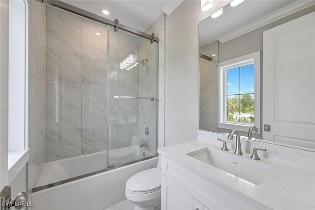 full bathroom featuring vanity, shower / bath combination with glass door, crown molding, and toilet