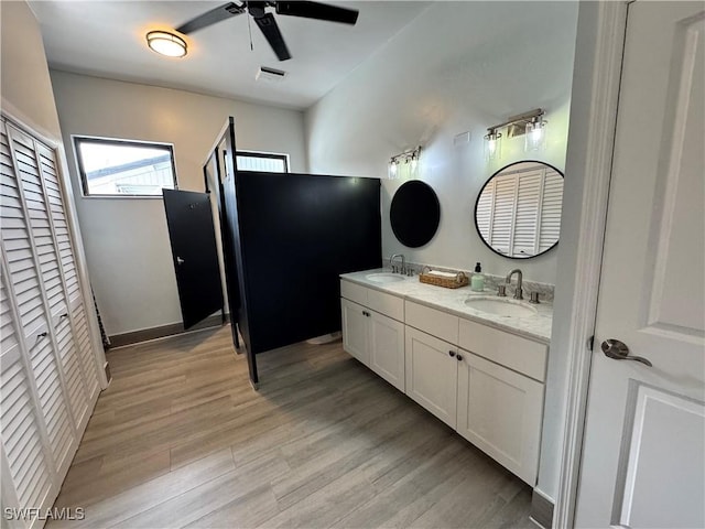 bathroom with vanity, ceiling fan, and hardwood / wood-style floors