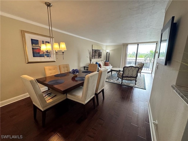 dining room featuring a wall of windows, ornamental molding, dark wood-type flooring, and an inviting chandelier