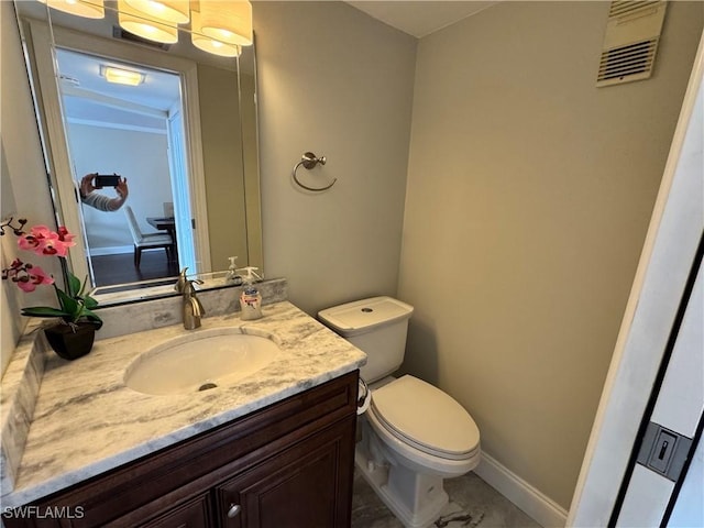 bathroom with toilet and vanity