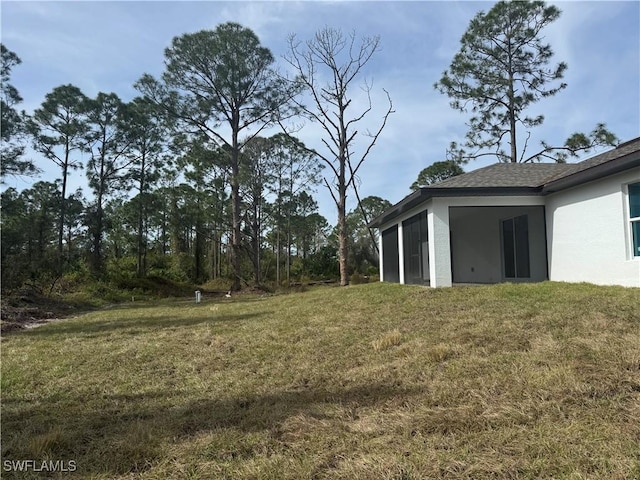 view of yard featuring a sunroom