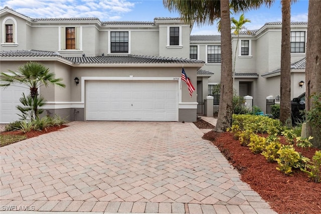 mediterranean / spanish-style house featuring a garage