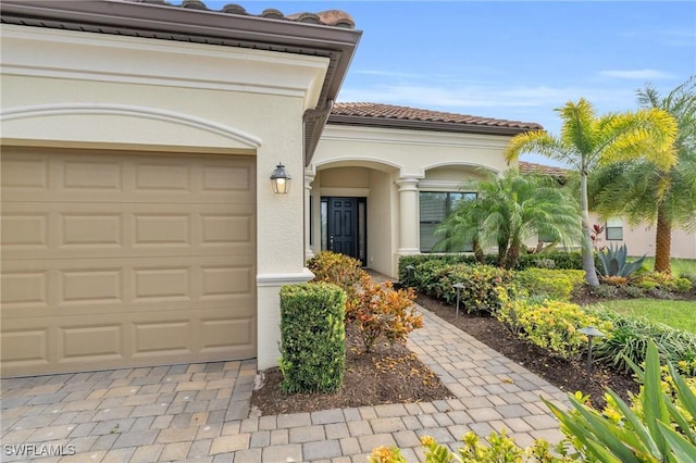 entrance to property featuring a garage