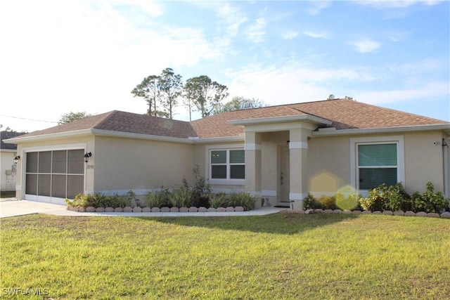 view of front of property featuring a garage and a front yard