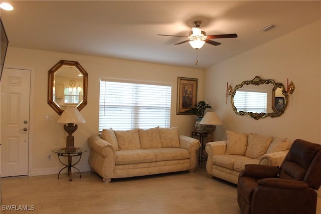 living room with ceiling fan and a healthy amount of sunlight