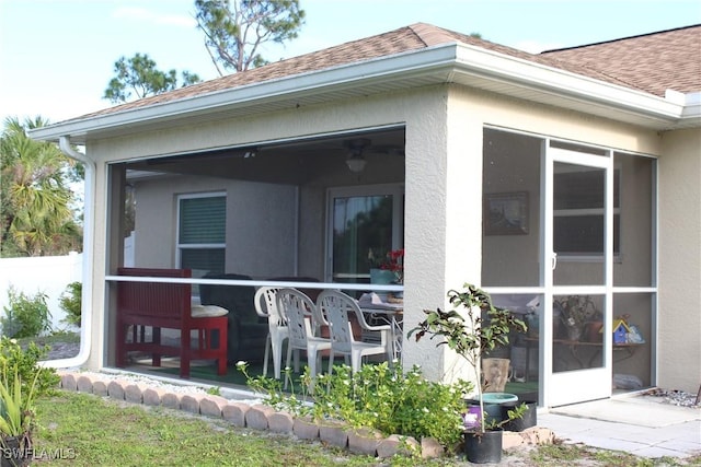 back of house with a sunroom